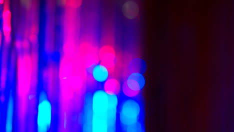Defocused-Close-Up-Shot-Of-Sparkling-Tinsel-Curtain-In-Night-Club-Or-Disco-With-Flashing-Strobe-Lighting-3